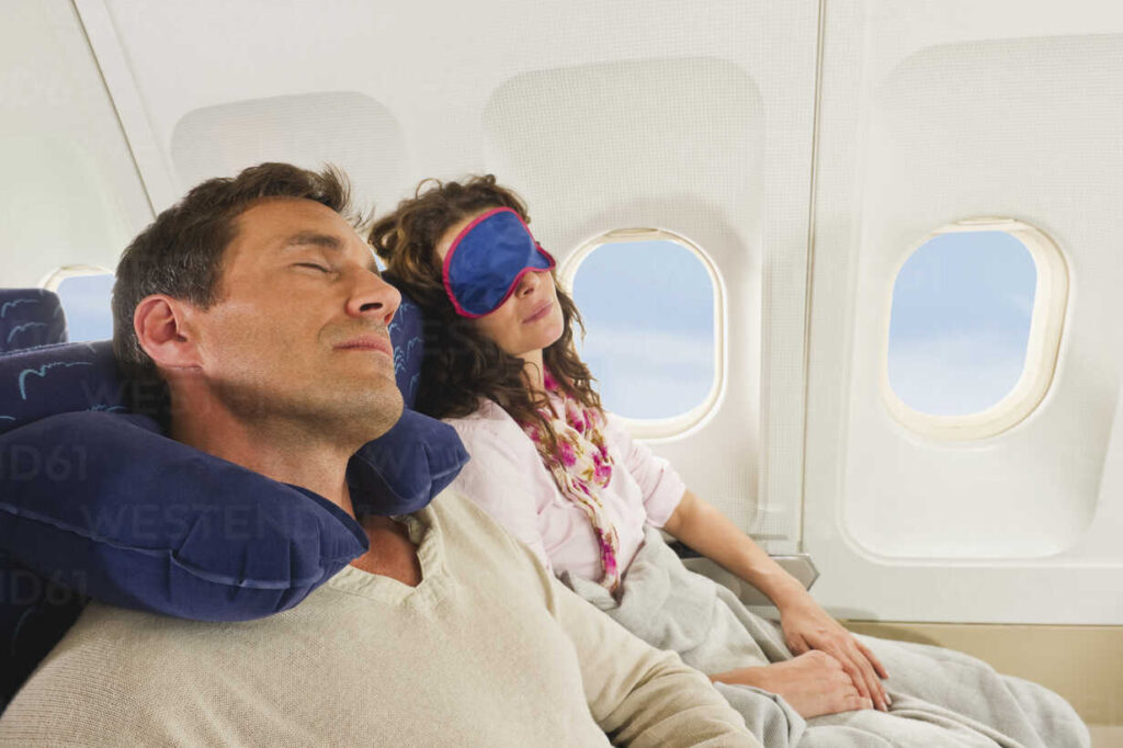 Couple Sleeping in Flight