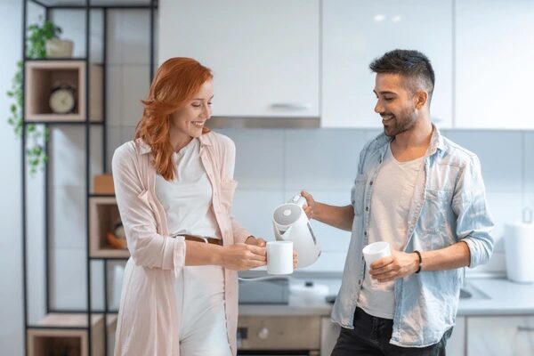 Couple with electric kettle